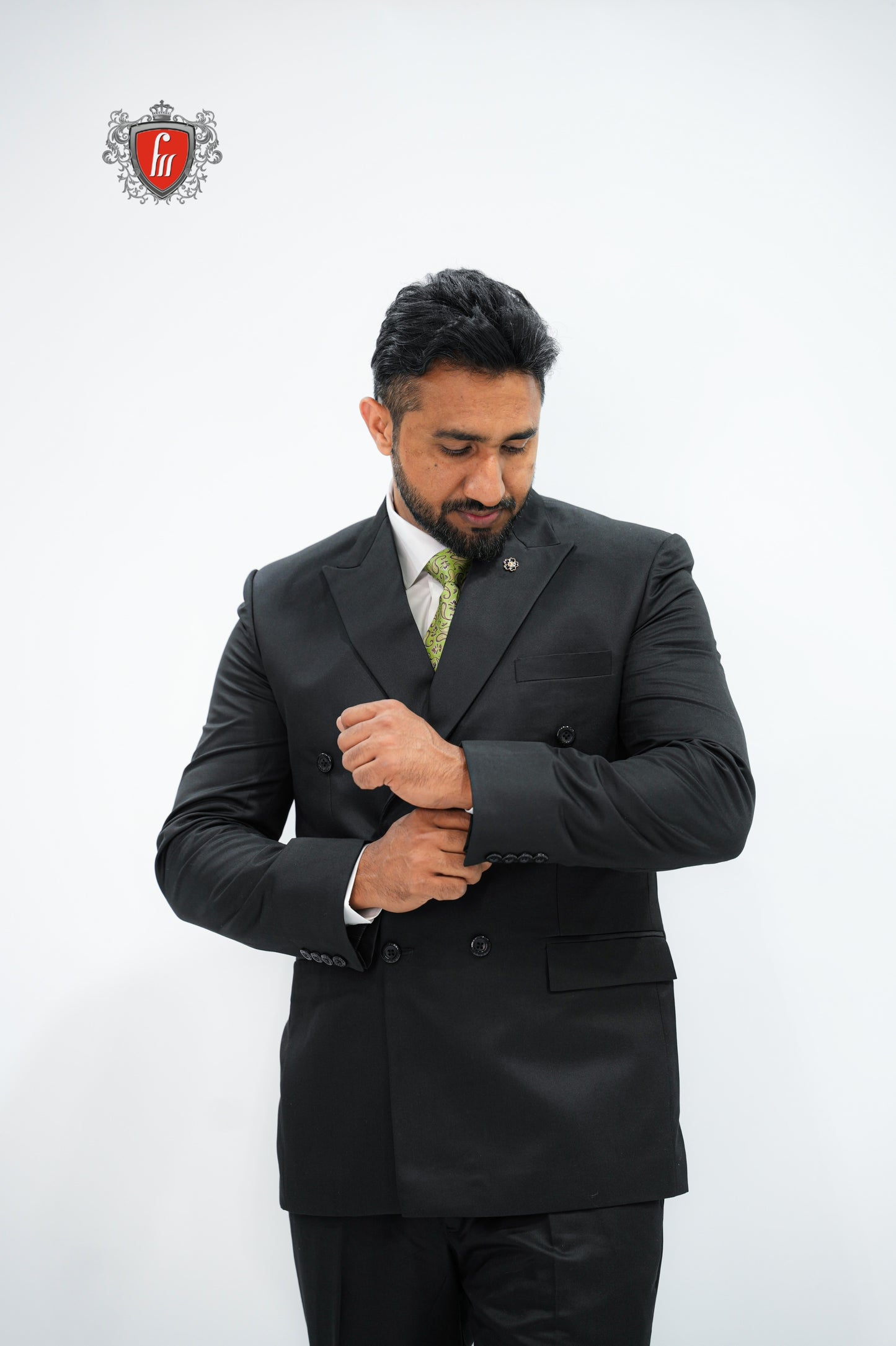 Refined Men’s Black Double-Breasted Suit with Classic Green Tie - The Mark of a True Gentleman