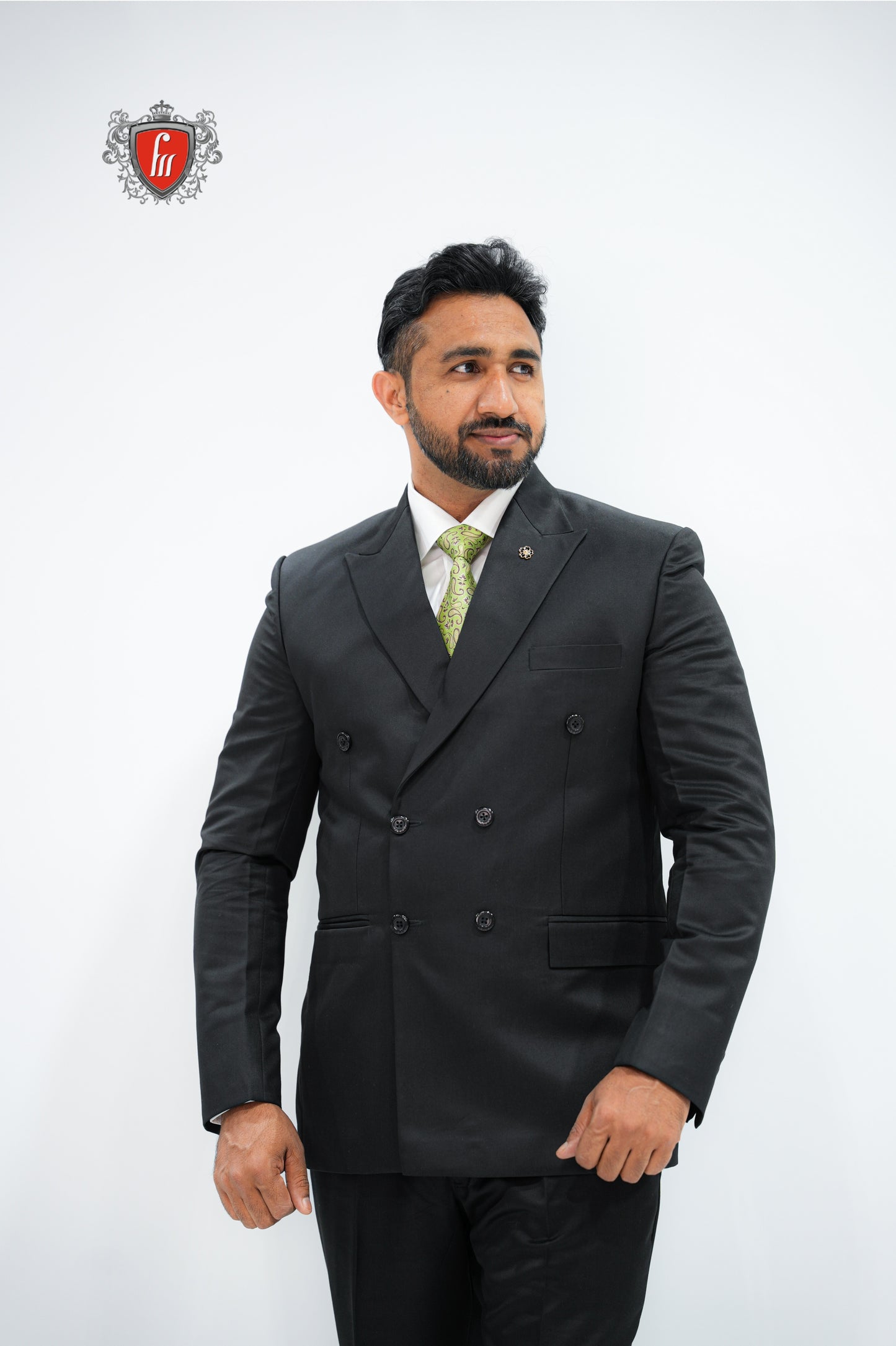 Refined Men’s Black Double-Breasted Suit with Classic Green Tie - The Mark of a True Gentleman
