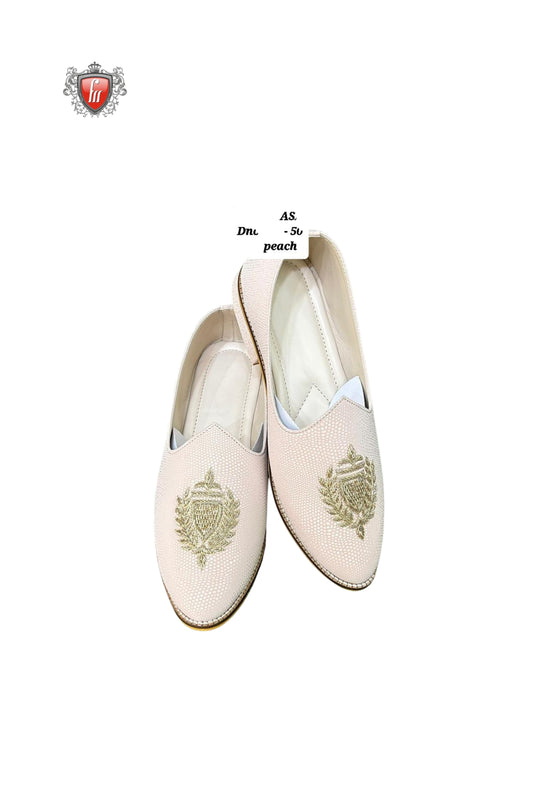 Fabmark Peach Textured Jutti with Golden Crest Embroidery – Elegant Ethnic Footwear
