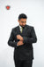 Refined Men’s Black Double-Breasted Suit with Classic Green Tie - The Mark of a True Gentleman